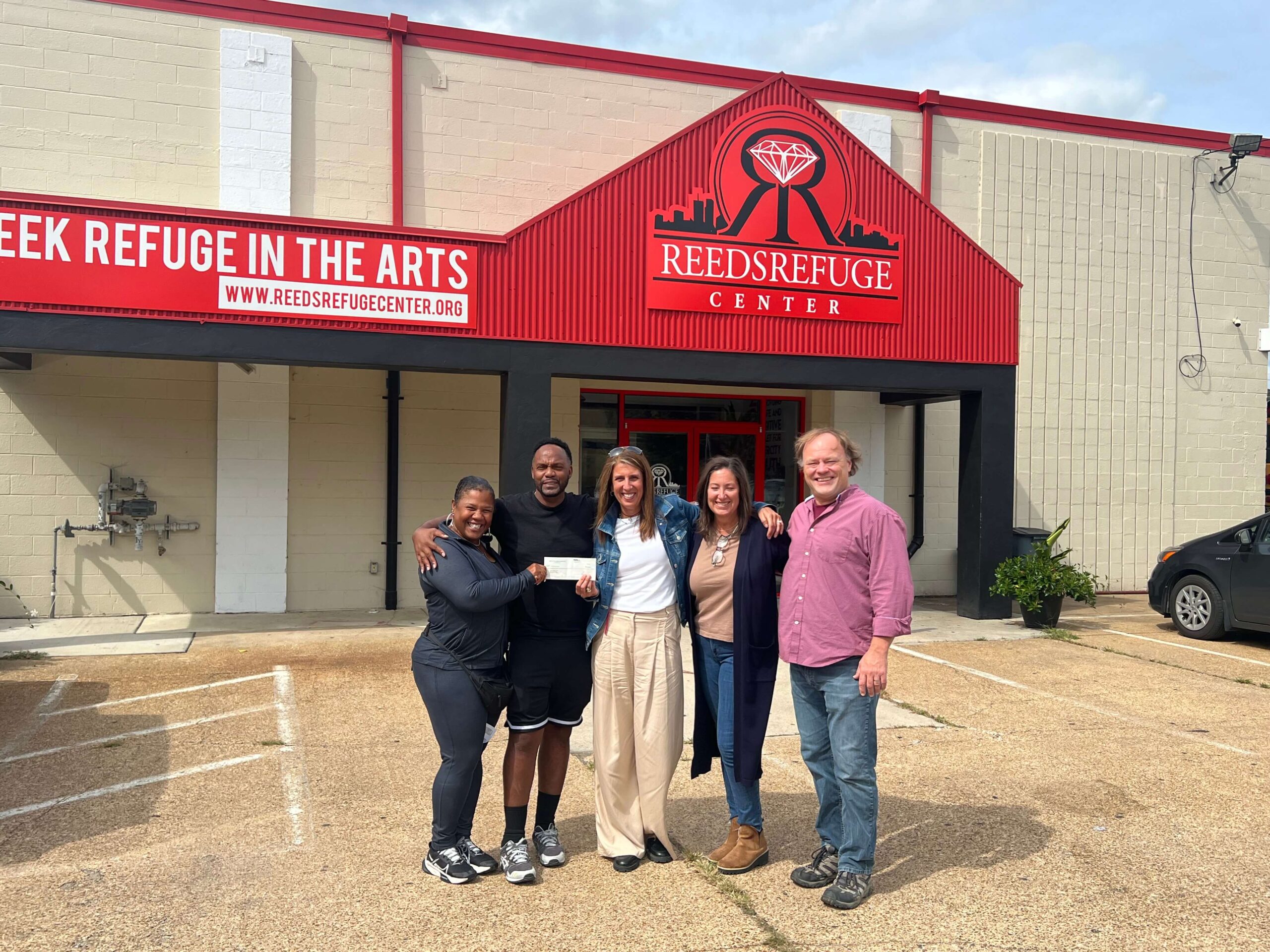 A visit from Light Up The Queen Foundation outside Reed’s Refuge Center, from the Wall of Fame archive