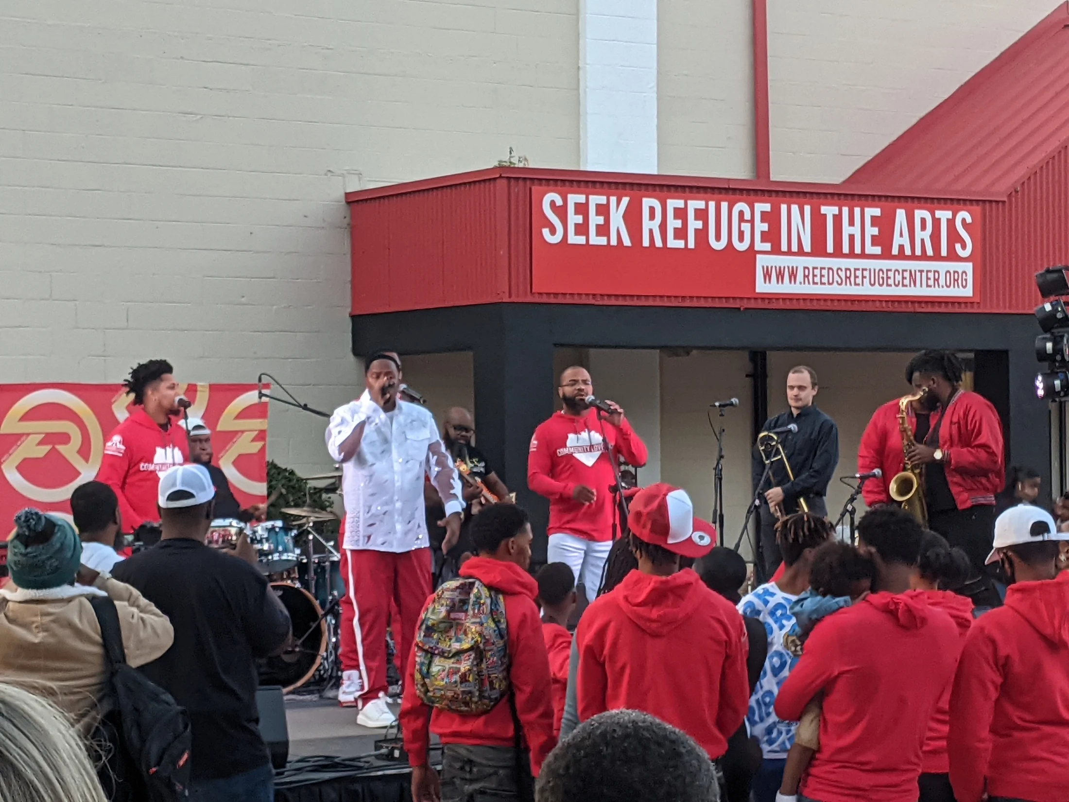 Young people performing for the community outside Reed’s Refuge Center in Wilmington