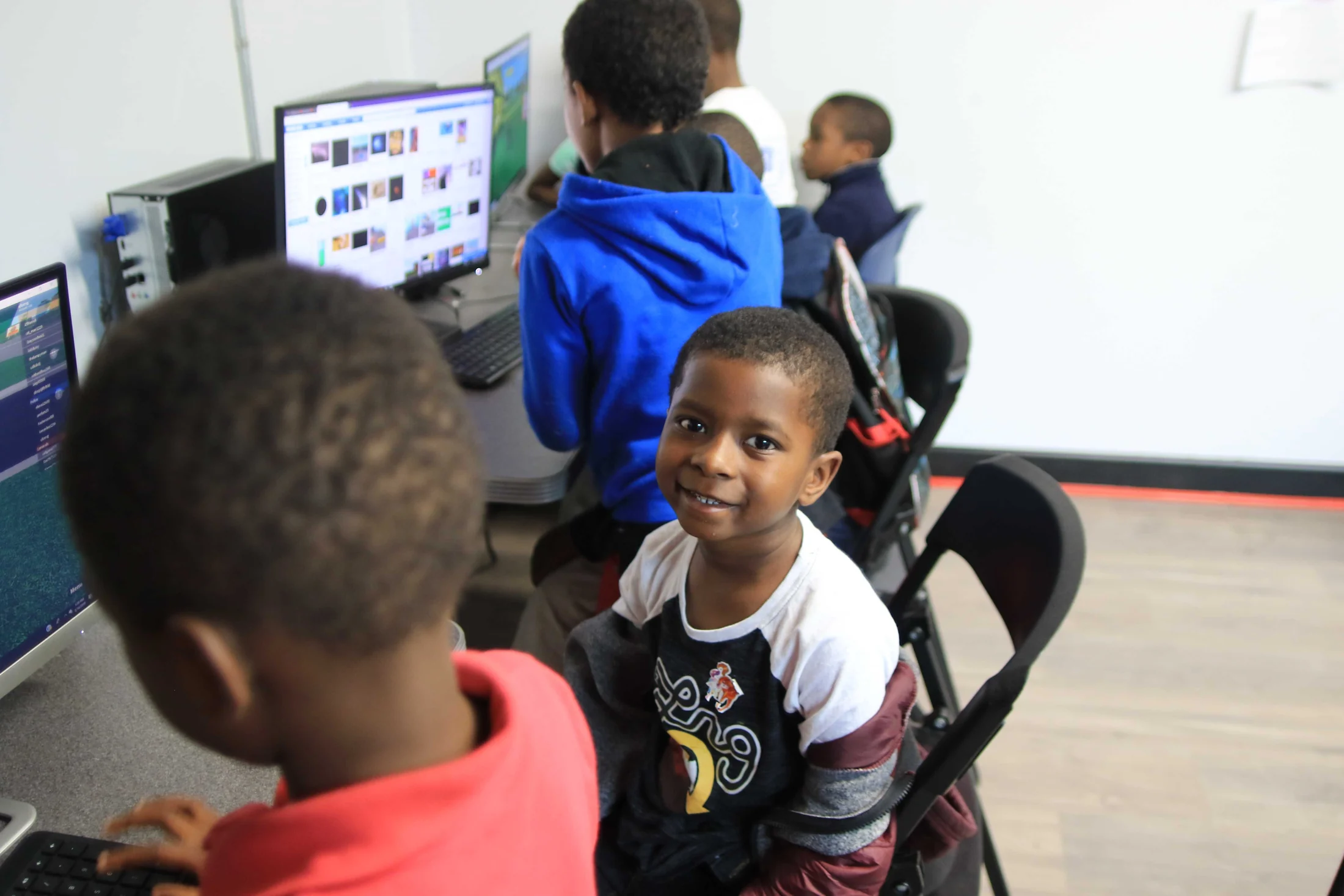 Children learning together in the Reed’s Refuge computer lab