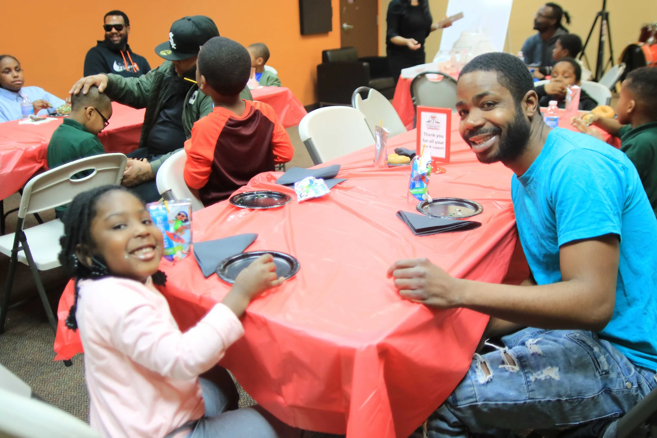 A family enjoying the Donuts With Dads event at Reed’s Refuge Center