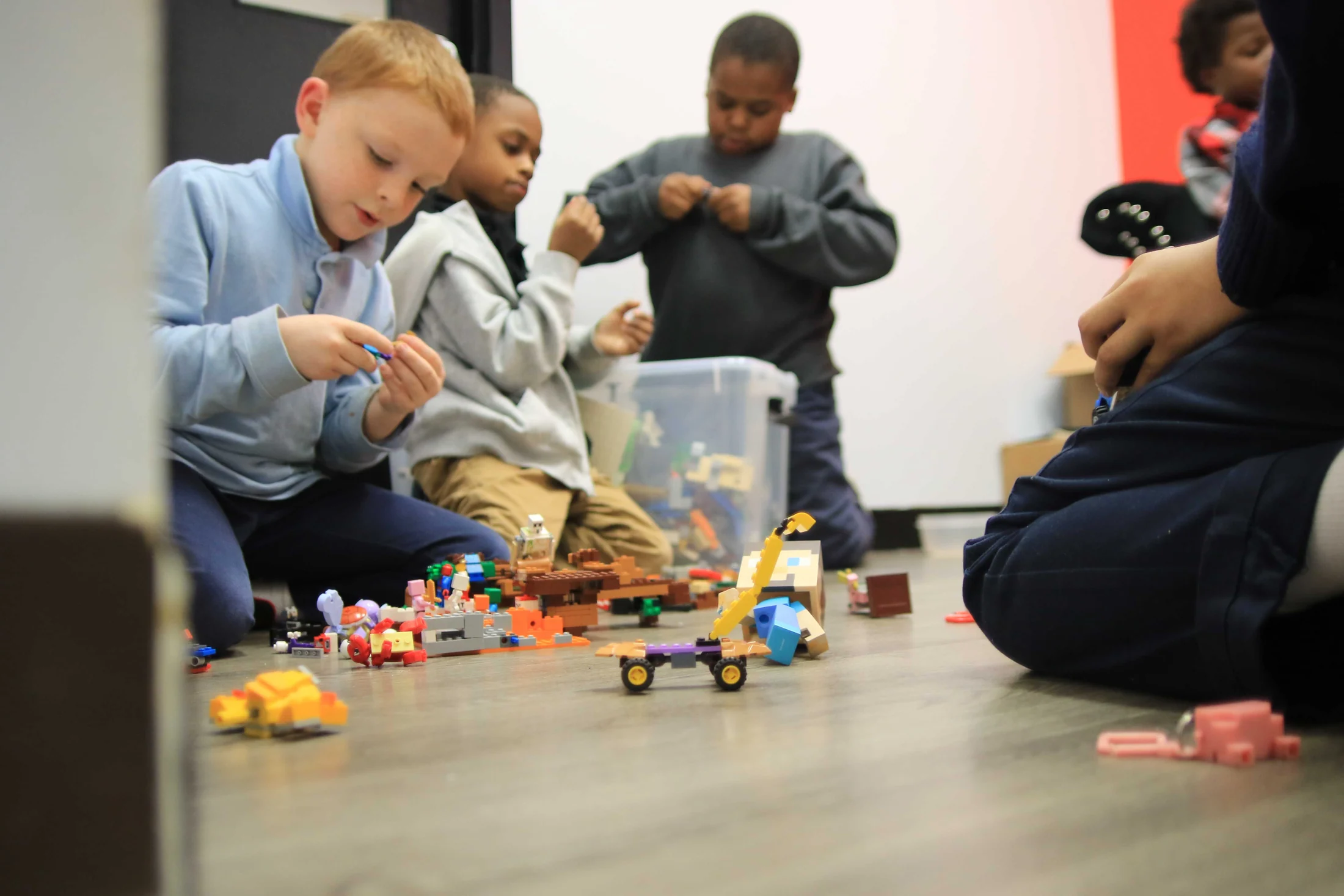 Children building together with construction toys at Reed’s Refuge Center