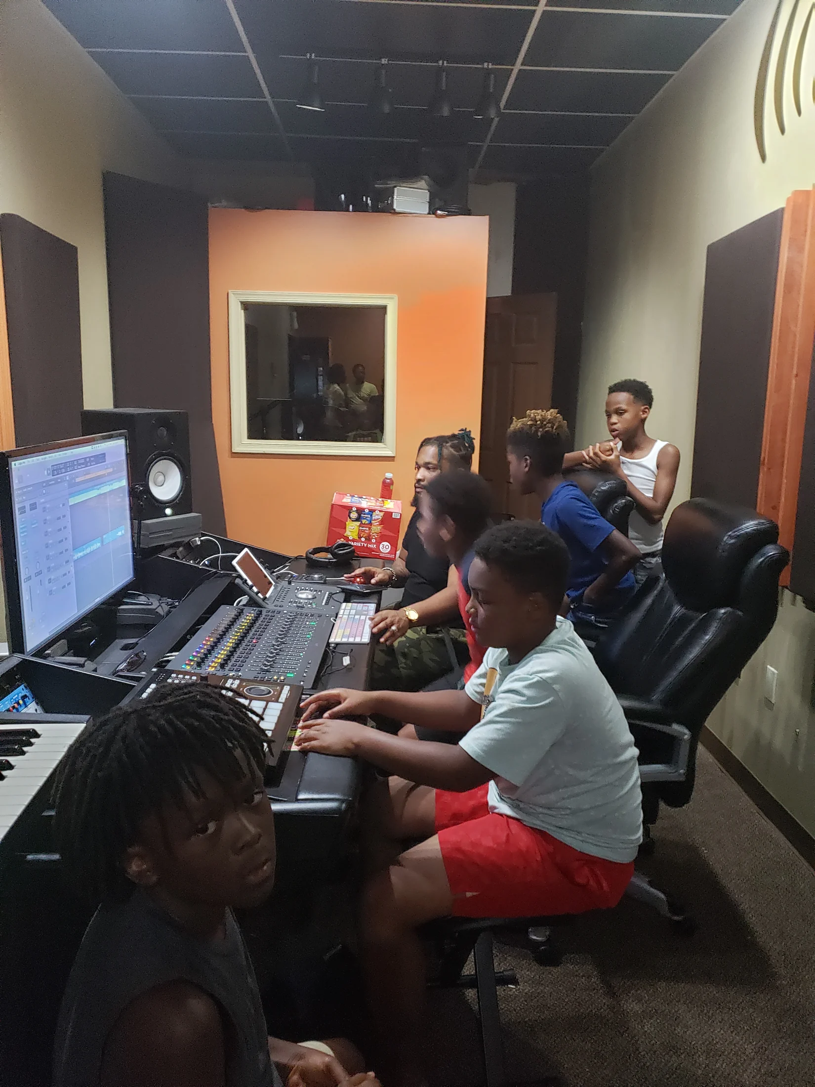 Young people learning recording and production skills together in the Reed’s Refuge studio