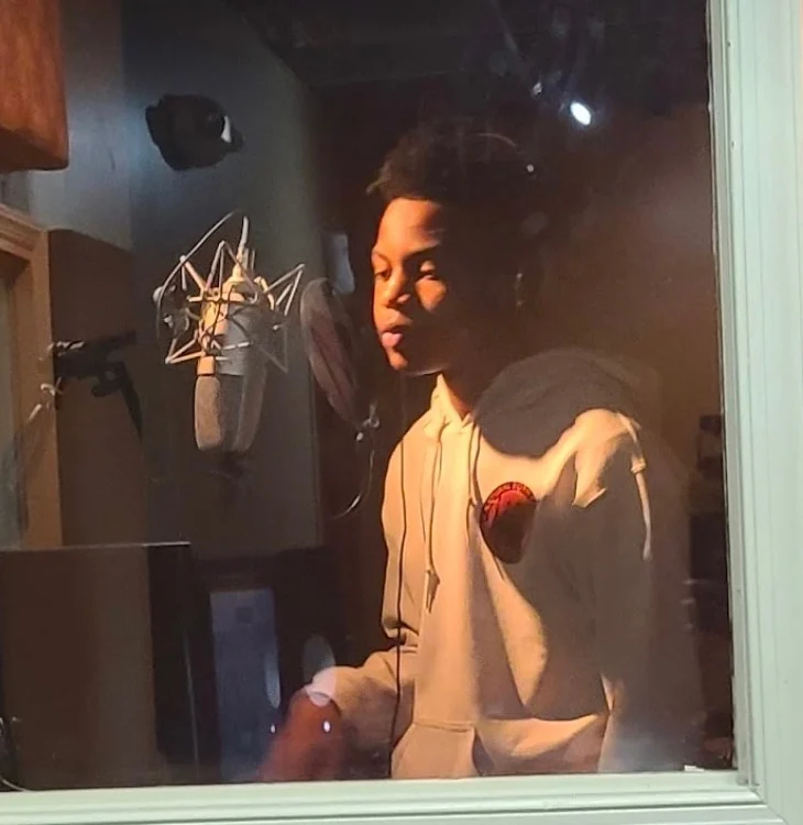 A young vocalist recording in the Reed’s Refuge studio